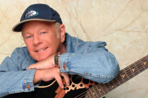 Graham Bonney mit Westerngitarre